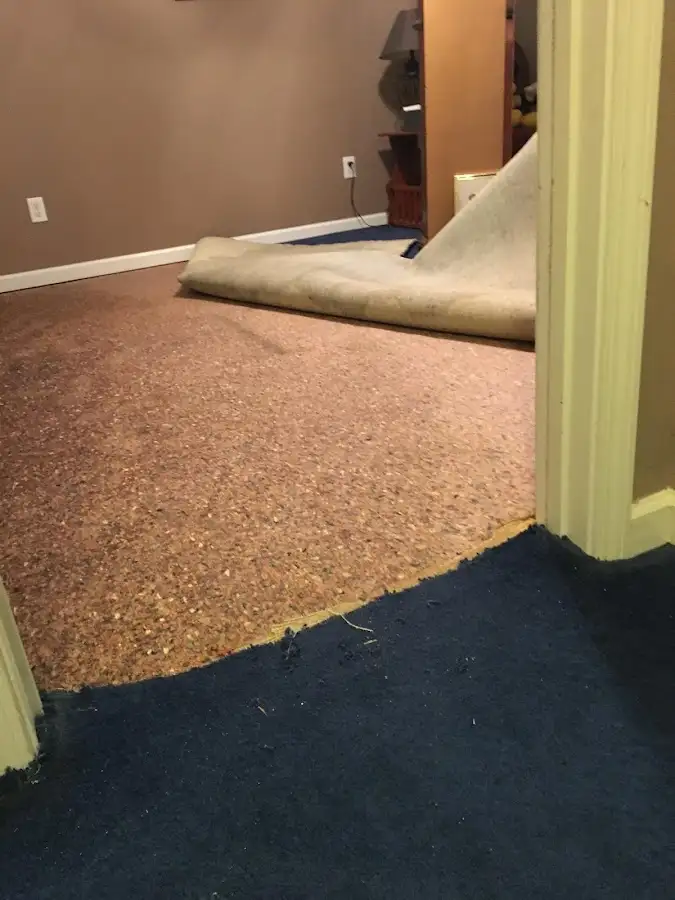 Carpet pad removal revealing water damage during Drying & Dehumidification in Martinez